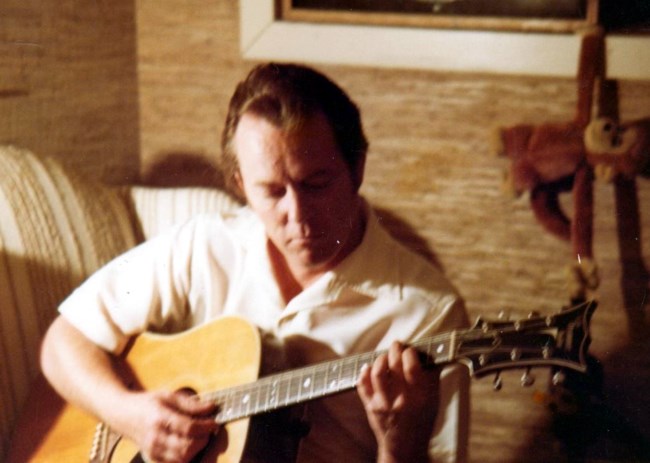 Billy Sherrill playing guitar