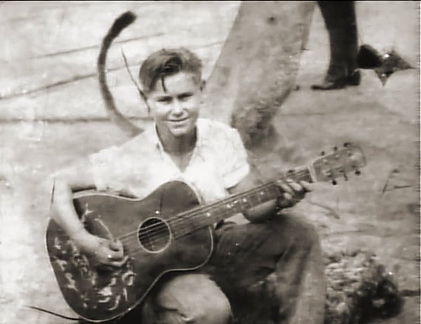 young George Jones with Gene Autry guitar
